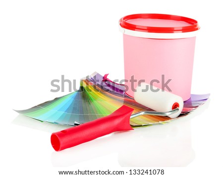 Paint pot, paint-roller and coloured swatches isolated on white