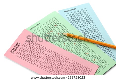 Lottery tickets and pencil, isolated on white