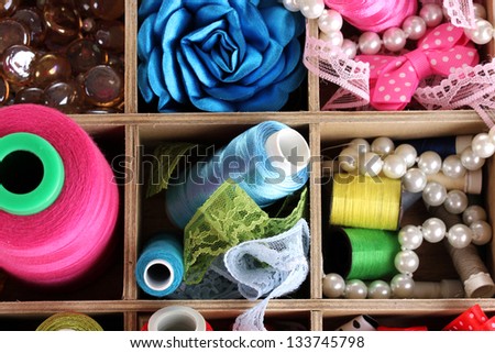 thread and material for handicrafts in box close-up