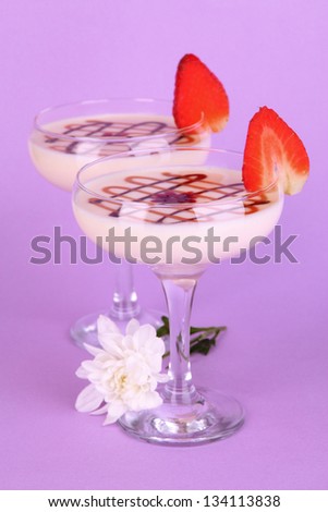Fruit smoothies on lilac background