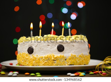Happy birthday cake, on black background