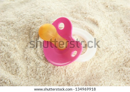 Powdered milk with nipple for baby  close-up