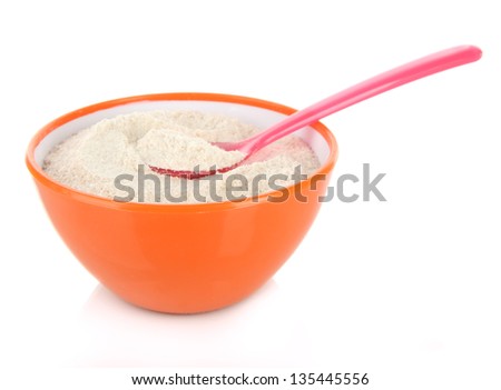 Powdered milk in bowl and spoon for baby isolated on white