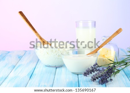Glass of milk and cheese on  light background