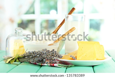 Glass of milk and cheese  on bright background