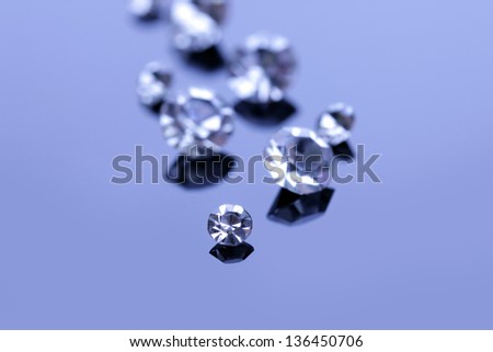 Beautiful shining crystals (diamonds), on blue background