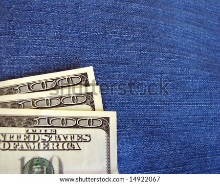 Dollar bank notes on the  jeans fabric