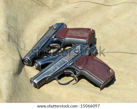 old guns on the brown background