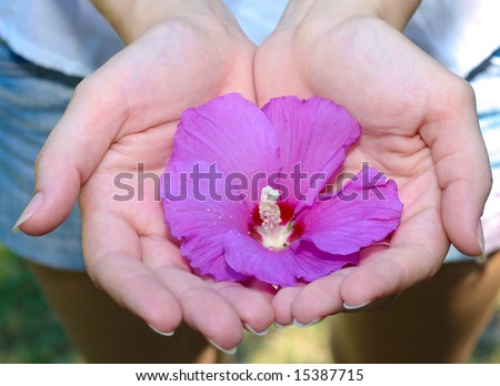 Girl hold flower in hands