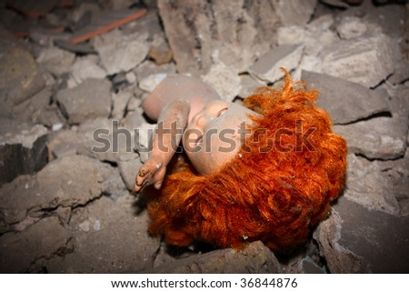 Old redhead doll in ruined house
