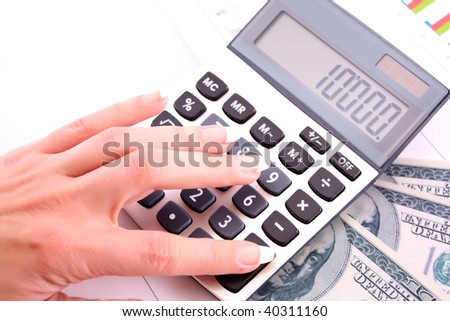 Calculator  and woman hand counts money