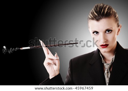 Woman with cigarette holder in office suite