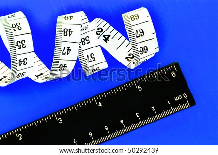 Tape measure  and ruler on yellow background