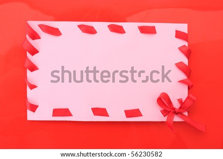 cardboard tags with red ribbon bow  on red
