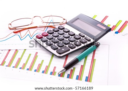 Coins, pen, calculator and charts