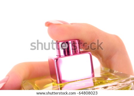 bottle of perfume in the hand isolated on white