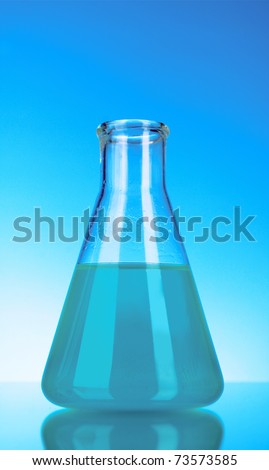 Conical flask on blue background