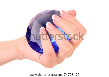 Giant blue diamond in hand isolated on white
