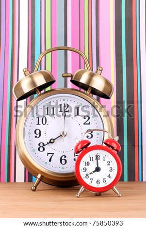 Two clocks    on  color background