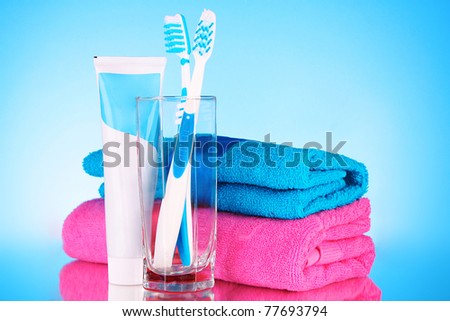 Tooth-paste and brush  on blue background