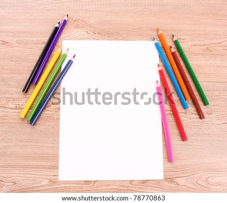 pencils and paper isolated on brown