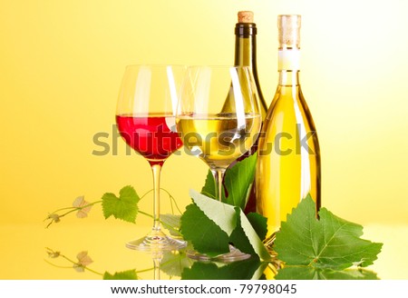 White and red wine on yellow background