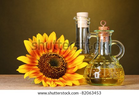 sunflower oil and sunflower on yellow background