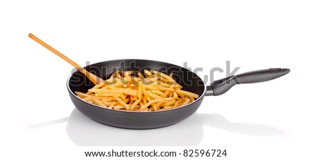 French fries in the pan isolated on white