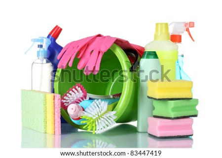 detergent bottles, brushes, gloves and sponges in bucket isolated on white