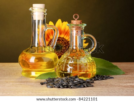 sunflower oil and sunflower on yellow background
