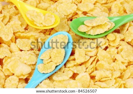 tasty cornflakes in plastic spoons