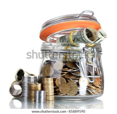 Clear glass jar for tips with money isolated on white (Ukrainian coins)