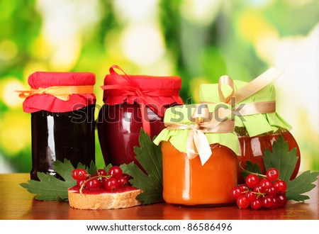 tasty berry and fruit jam and berry on a green background Listen berry and fruit jam and fruit Listen tasty berry and fruit jam and berry
