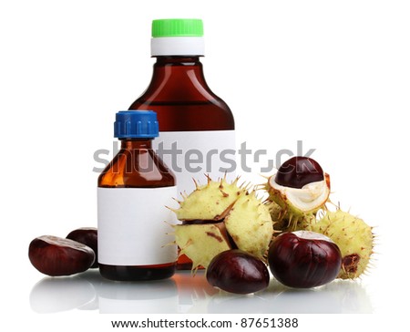 green and brown chestnuts and medical bottles isolated on white