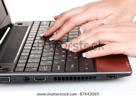 new laptop and woman hands isolated on white