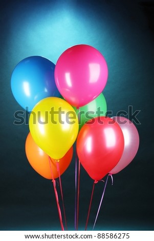 bright balloons on blue background