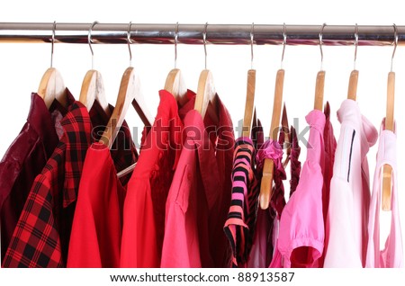 different clothes on hangers isolated on white