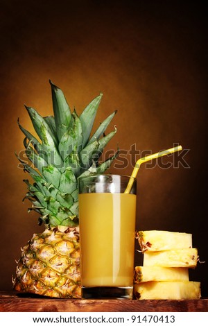 pineapple juice and pineapple on brown