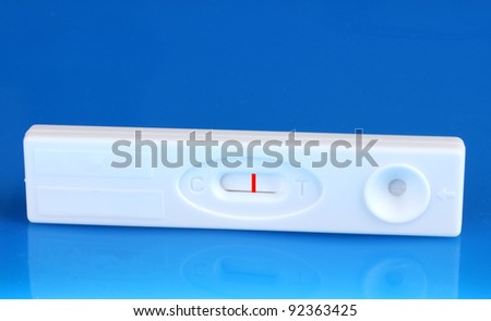 pregnancy test on blue background
