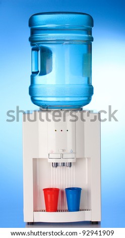 Electric water cooler on blue background