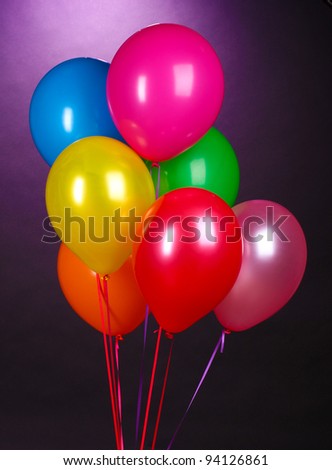 bright balloons on purole background
