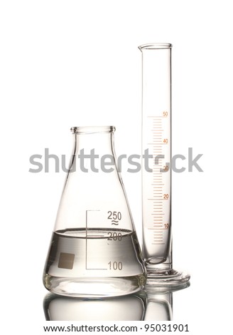 Flask with water and empty measuring beaker with reflection isolated on white