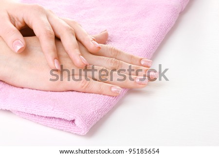 beautiful women hands on pink towel