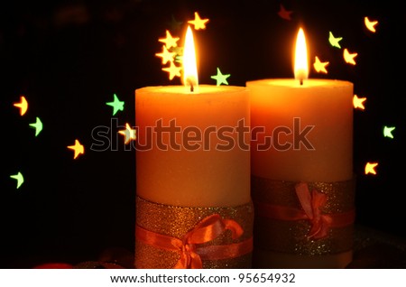 Beautiful candle and decor  on wooden table on bright background