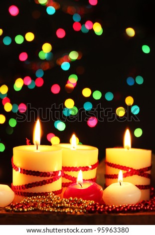 Beautiful candles and decor on wooden table on bright background