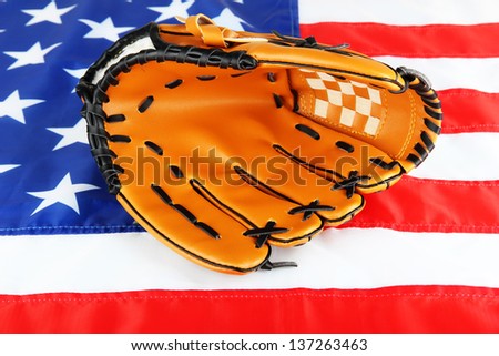 Baseball glove on American flag background