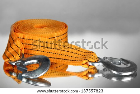 Tow rope for car on grey background