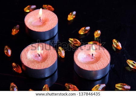 Red candles isolated on black