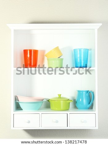 Kitchen utensils on beautiful white shelves