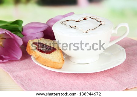 Composition of coffee, toast and tulips on bright background